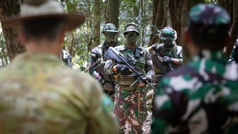 Indonesian Army soldiers (Tentara Nasional Indonesia) after participating in a section attack at the Junior Officer Combat Instructor Training Course held in Tully.