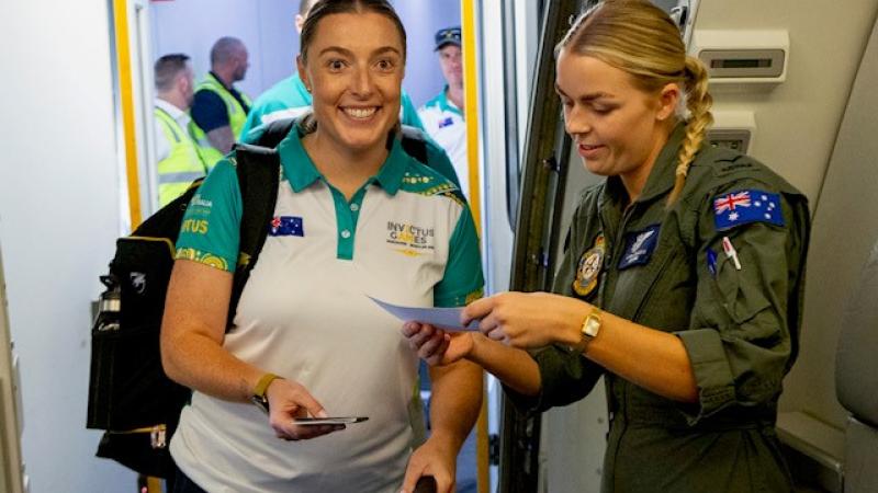 Invictus Games Vancouver Whistler 2025 competitor Sergeant Emily Lahey is welcomed on-board Royal Australian Air Force KC-30A aircraft by Leading Aircraftwoman Lily Cooper